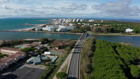 Car-crossing-a-bridge-la-Grande-Motte-France-aerial-view-mediterranean-beach